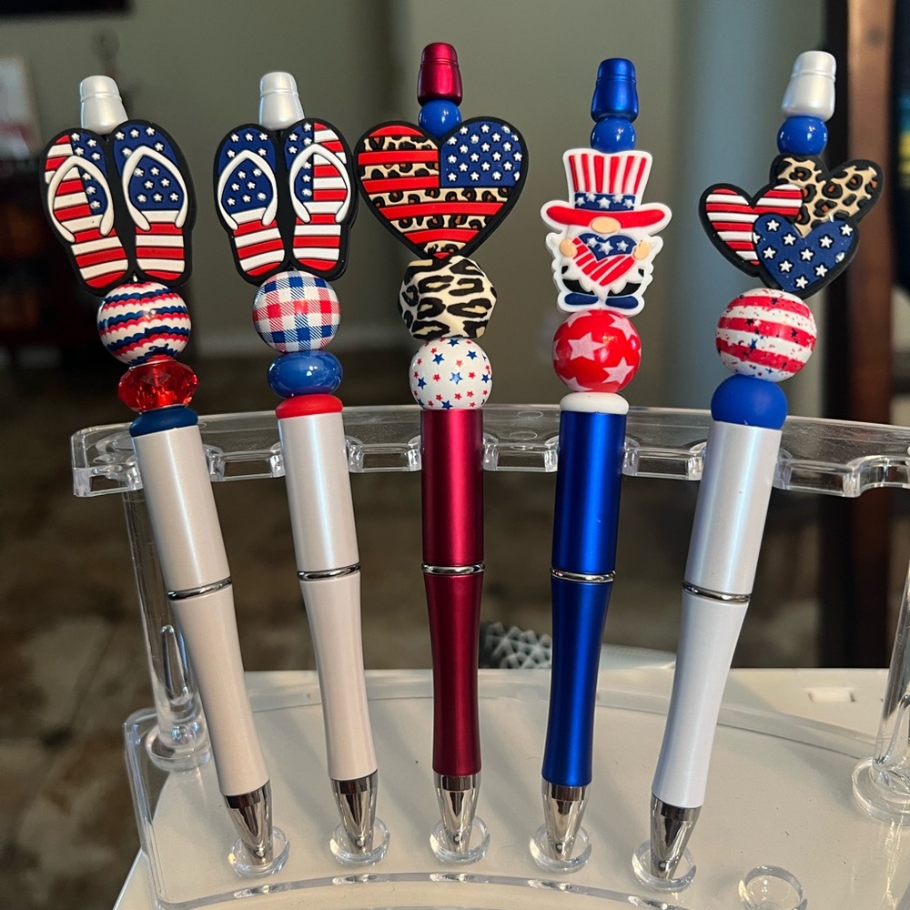 Cute red, white, and blue hand beaded ink pens.  Each sold separately